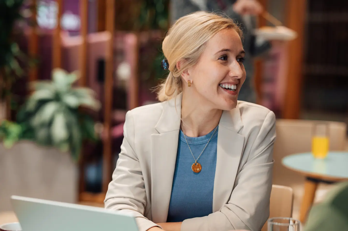Three Travel Counsellors looking at a laptop screen