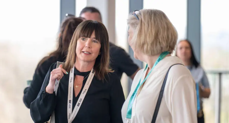 Attendees talking with the New Franchise Team at a Travel Counsellors Discovery Day in Manchester