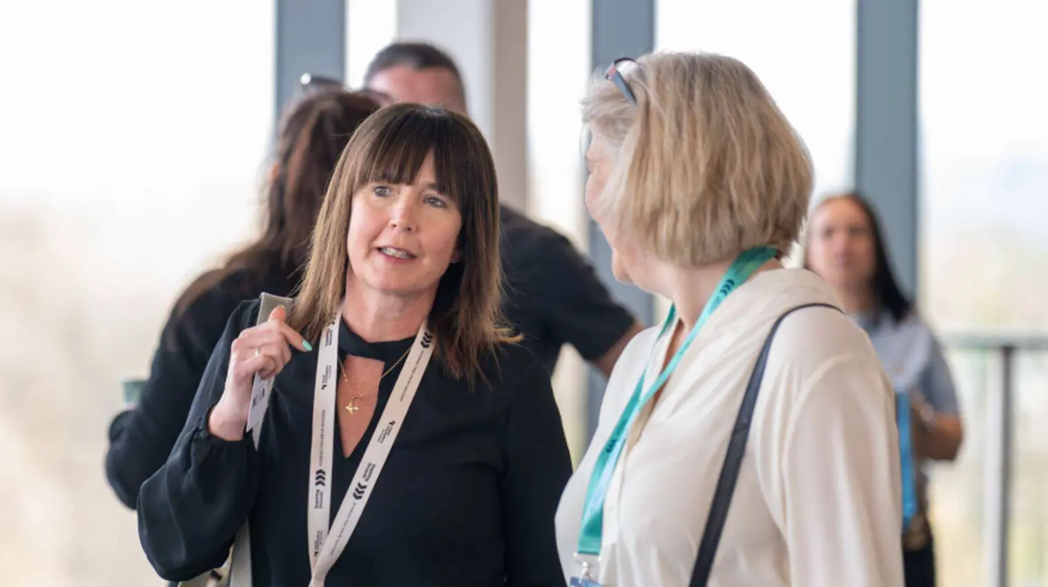 Attendees talking with the New Franchise Team at a Travel Counsellors Discovery Day in Manchester