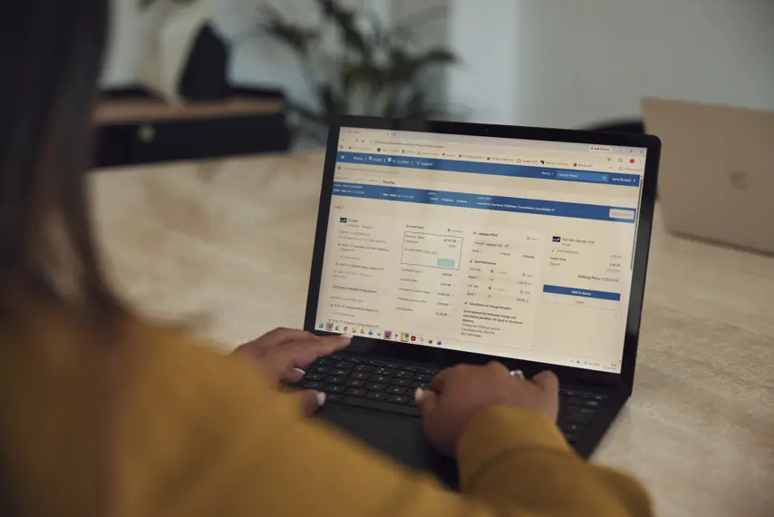 Phenix, Travel Counsellors' booking software, displayed on a laptop