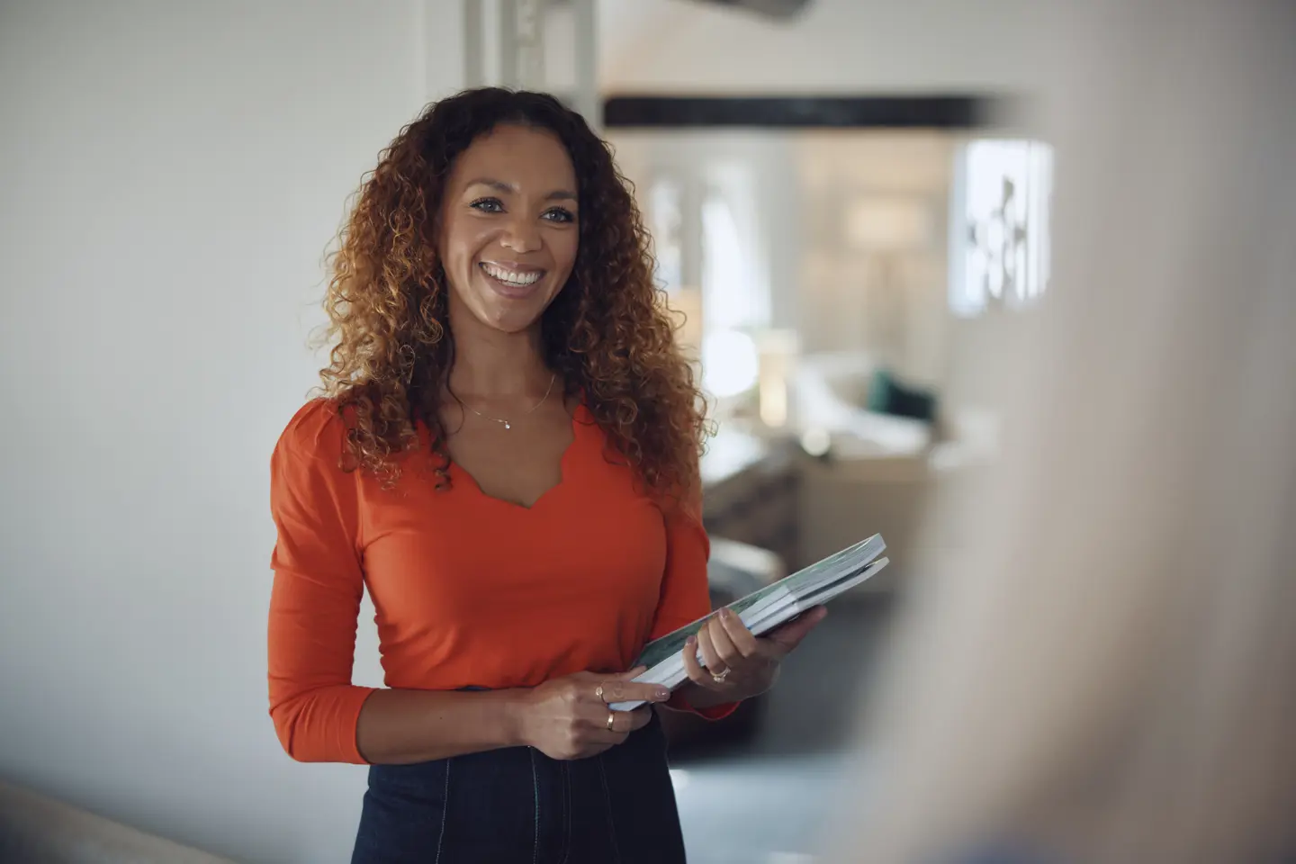 Female Travel Counsellor holding some travel brochures